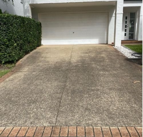 Dirty stained driveway before pressure washing